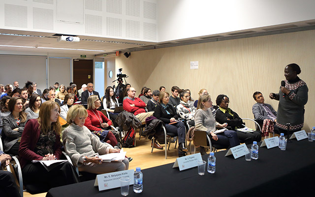 Dr. Kaase-Bwanga presents to fellow researchers in Barcelona